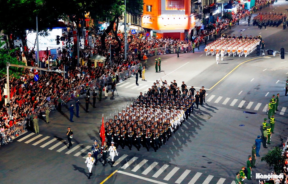 A group of people marching in a parade  AI-generated content may be incorrect.