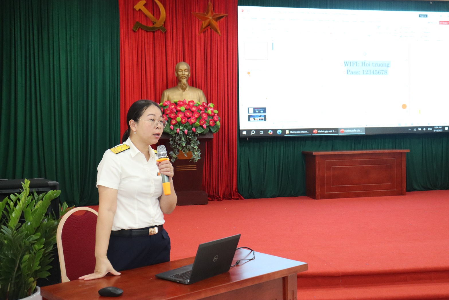 A person in uniform standing in front of a computer  AI-generated content may be incorrect.