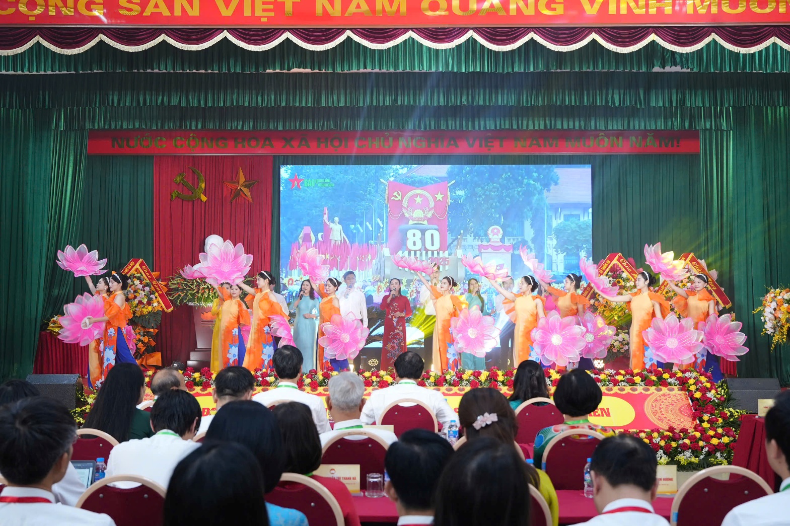 A group of people performing on stage  AI-generated content may be incorrect.