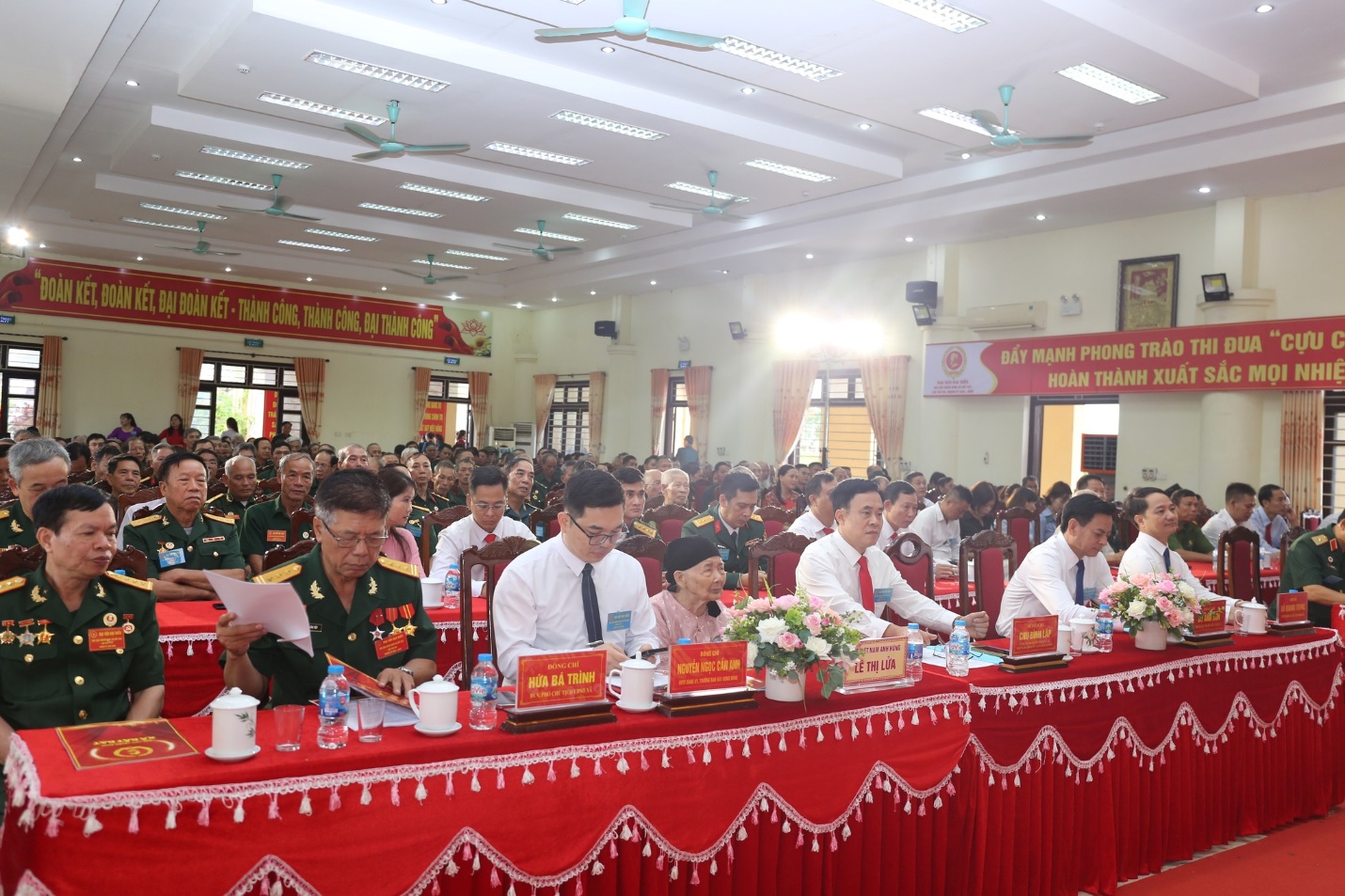 A group of people sitting at a table  Description automatically generated