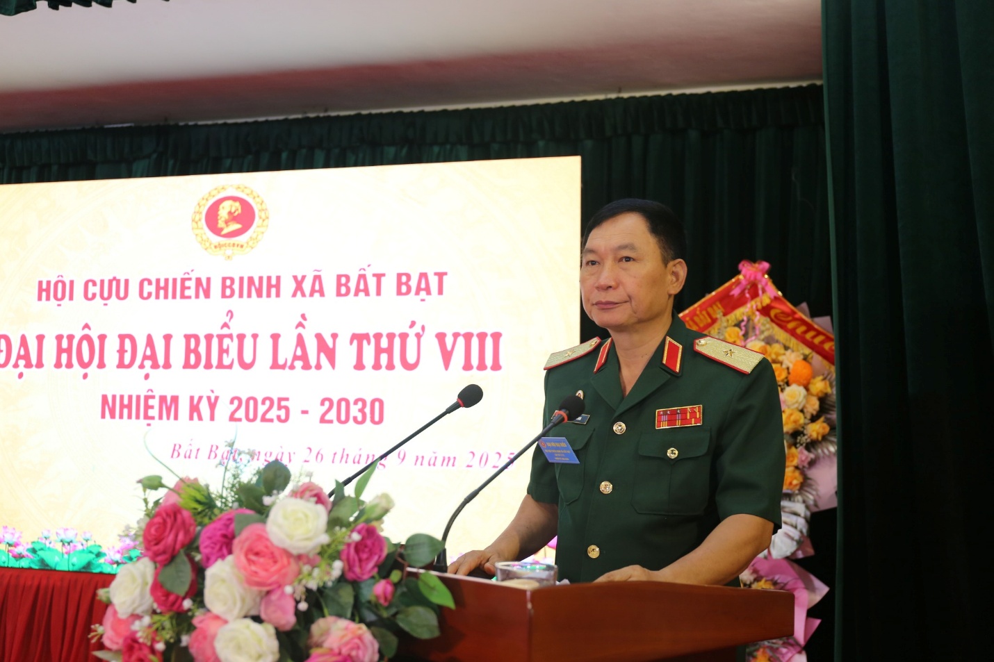 A person in uniform standing at a podium  Description automatically generated