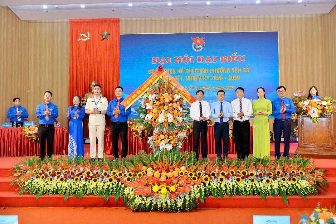 A group of people standing on a stage  AI-generated content may be incorrect.