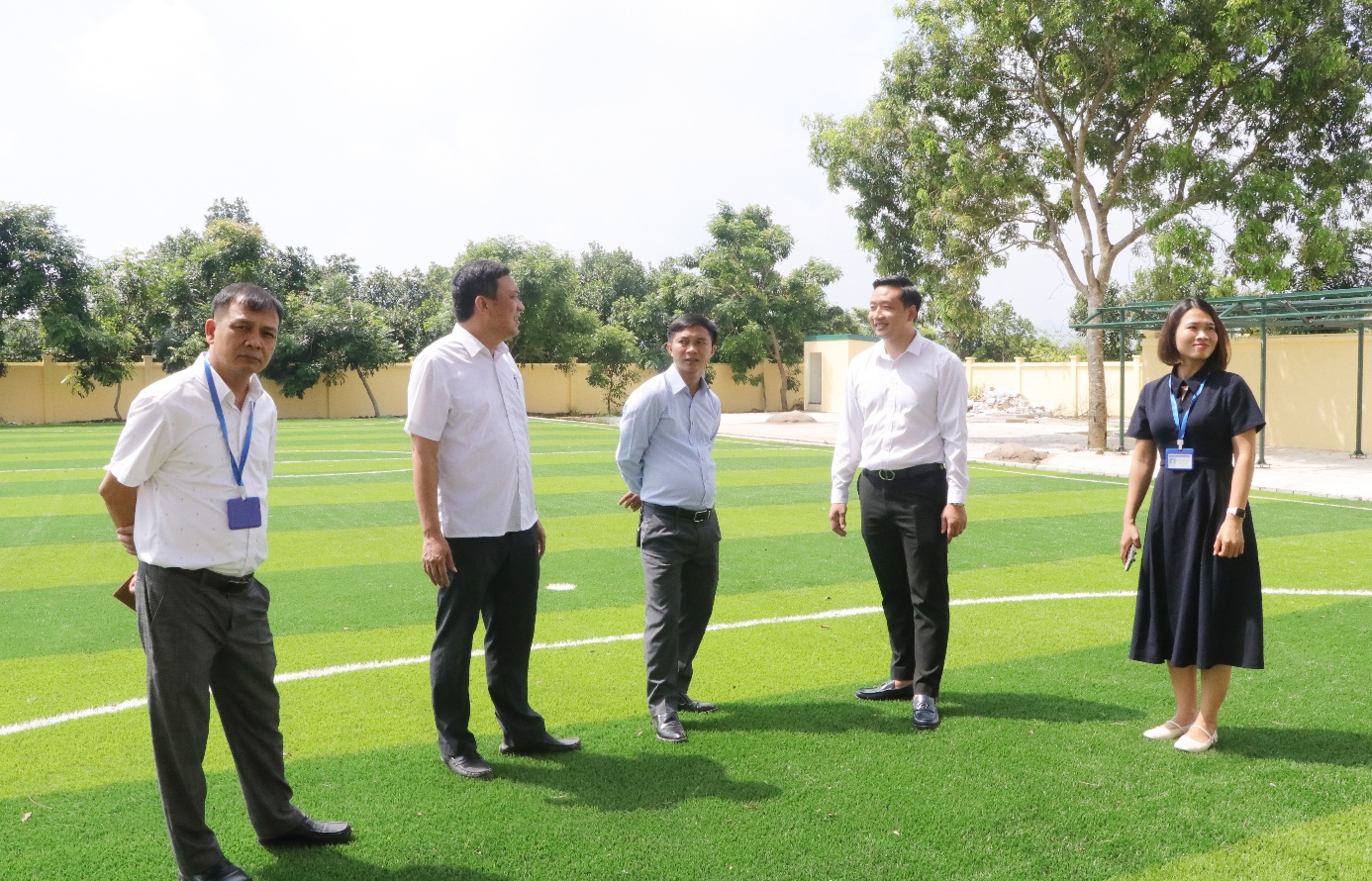 A group of men standing on a field  AI-generated content may be incorrect.