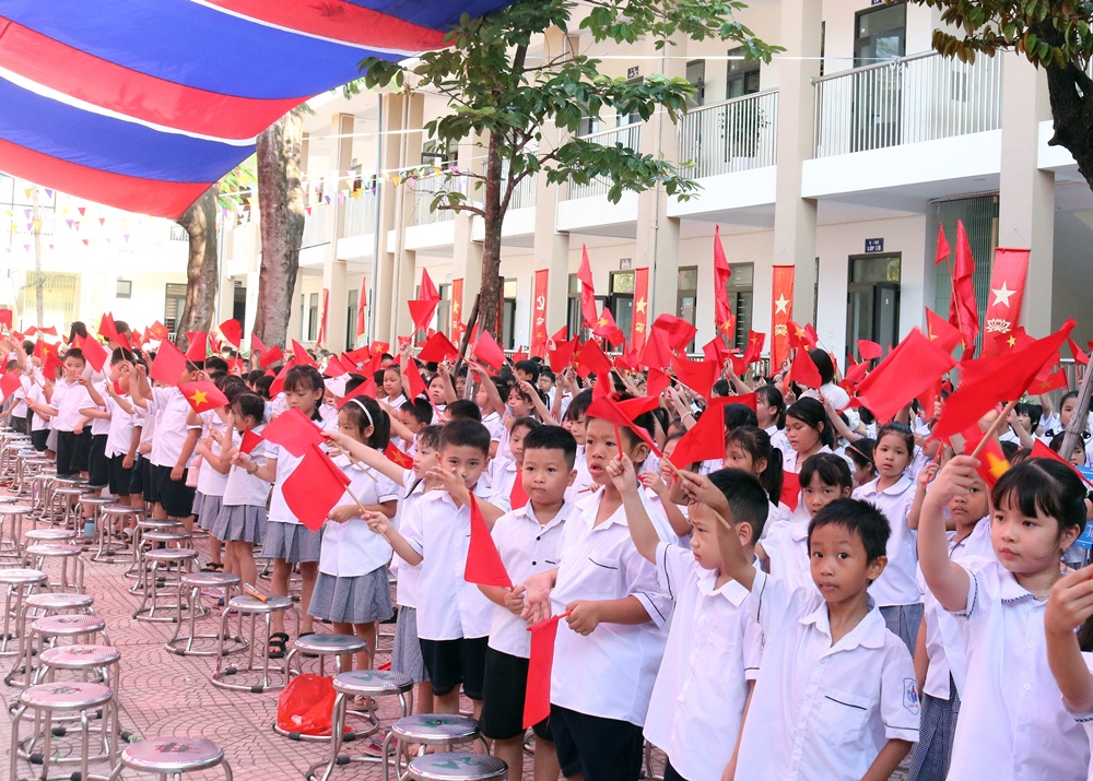 A group of children holding flags  AI-generated content may be incorrect.