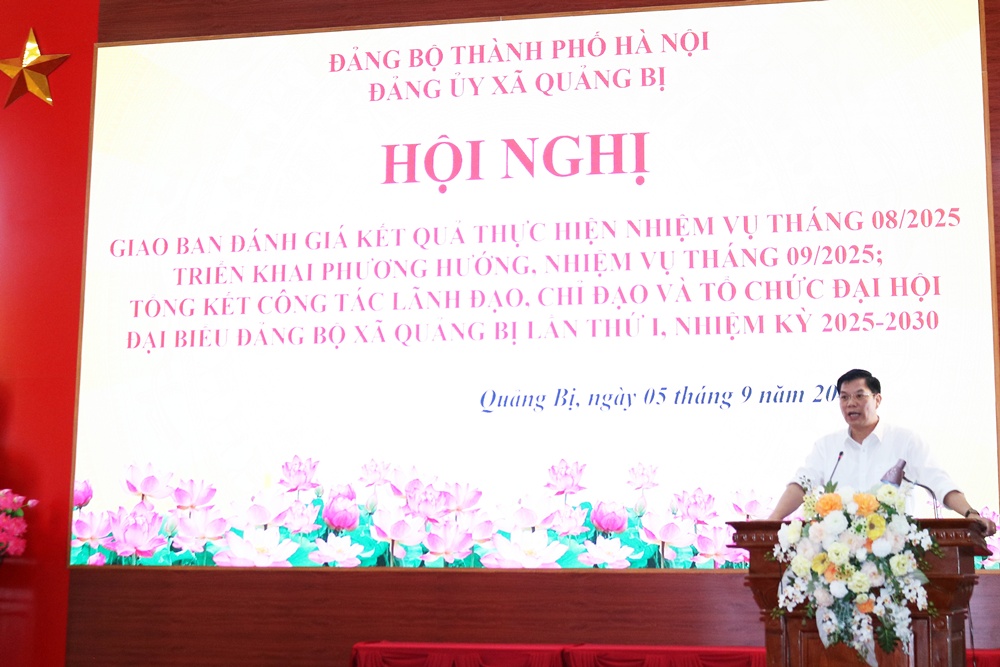 A person standing at a podium with flowers  AI-generated content may be incorrect.