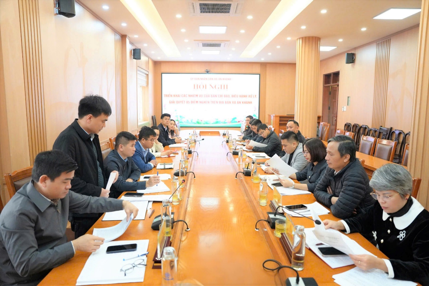 A group of people sitting at a table  AI-generated content may be incorrect.