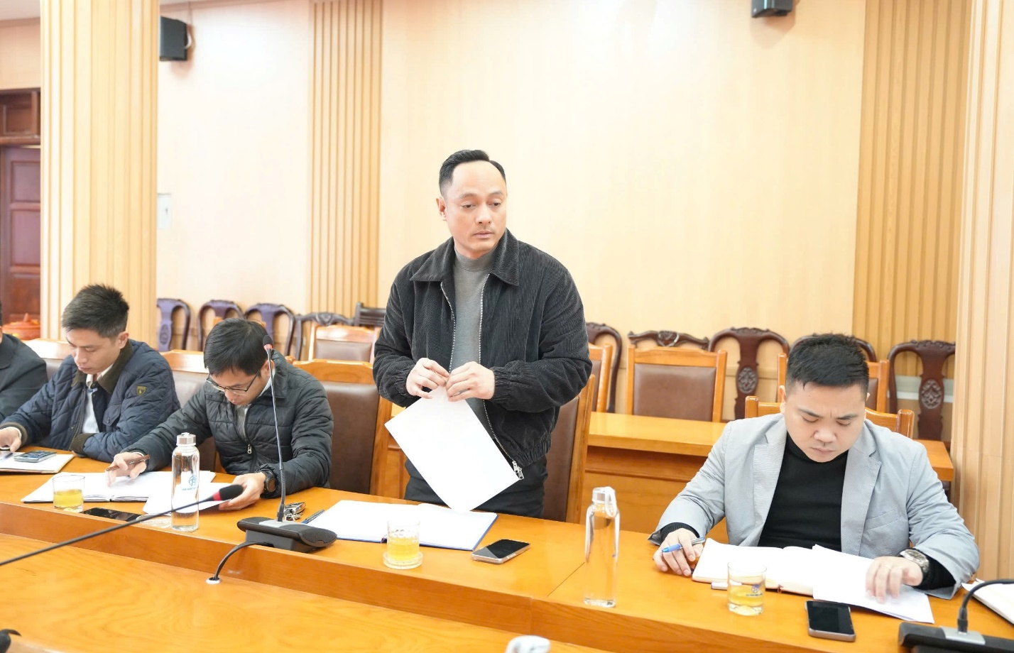 A group of people sitting at a table  AI-generated content may be incorrect.