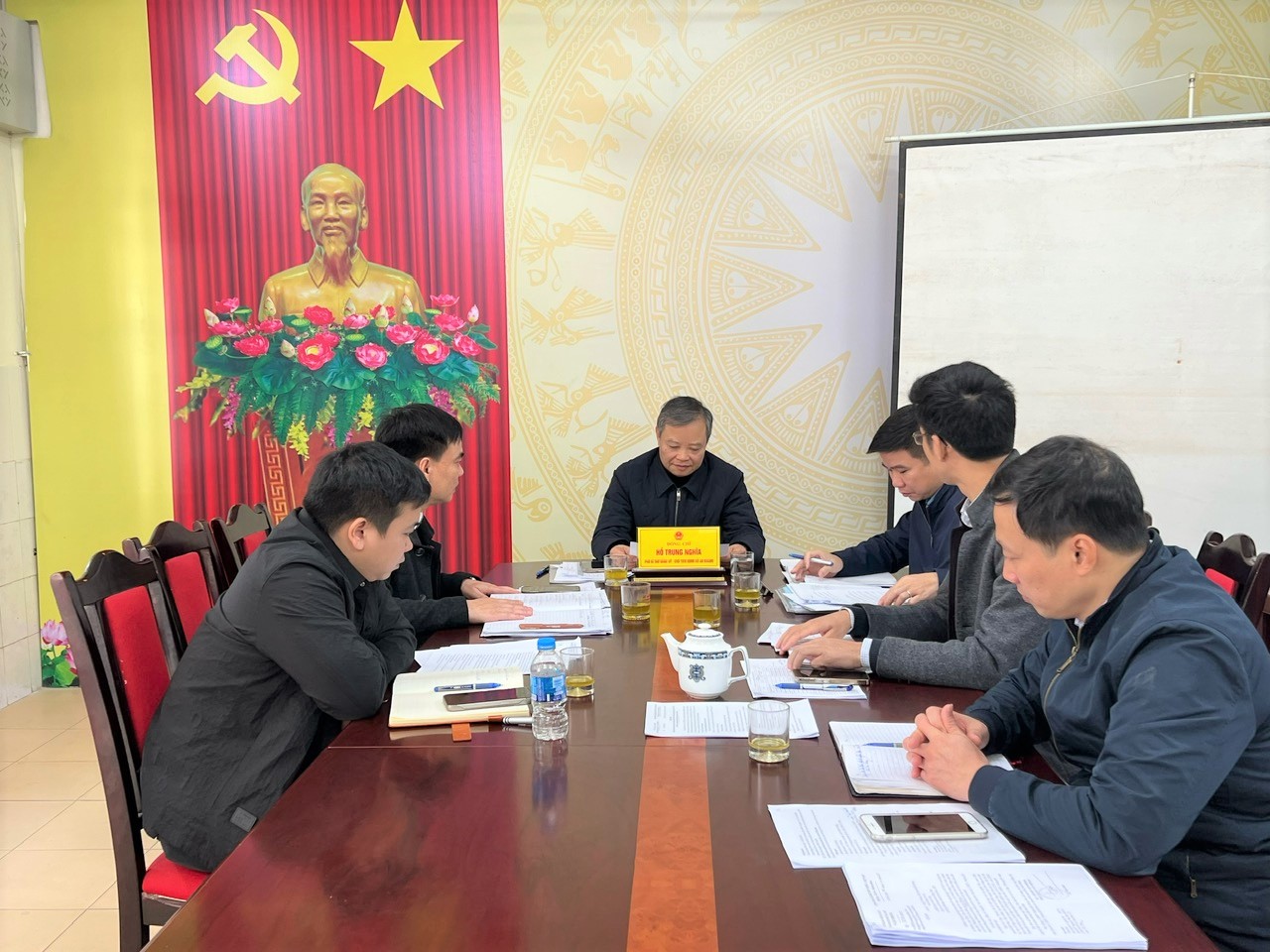 A group of people sitting around a table  AI-generated content may be incorrect.