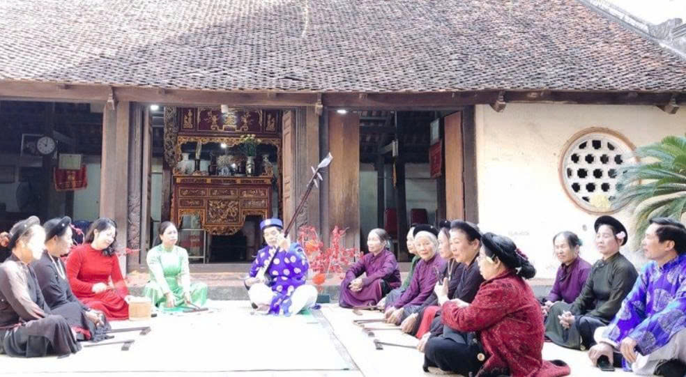 A group of people sitting outside a building  AI-generated content may be incorrect.