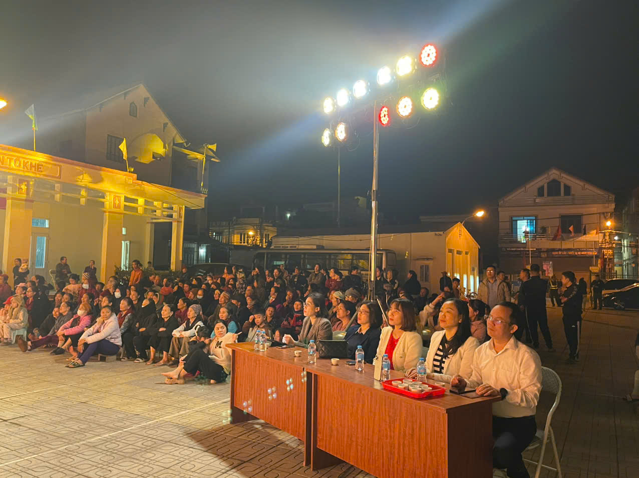 A group of people sitting at a table  AI-generated content may be incorrect.