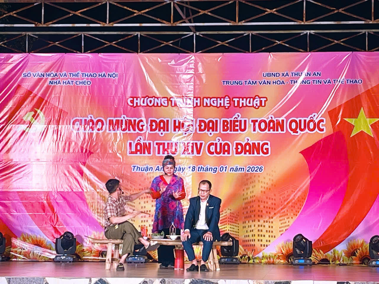 A group of people sitting on a stage  AI-generated content may be incorrect.