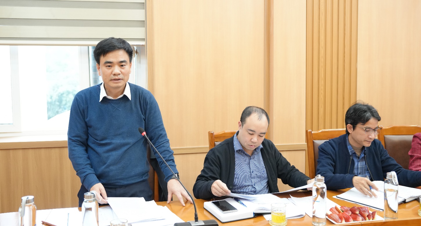 A group of men sitting at a table  AI-generated content may be incorrect.