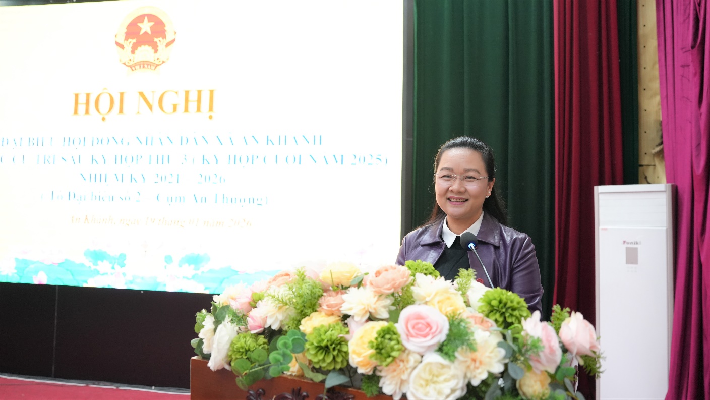 A person standing behind a podium with flowers  AI-generated content may be incorrect.