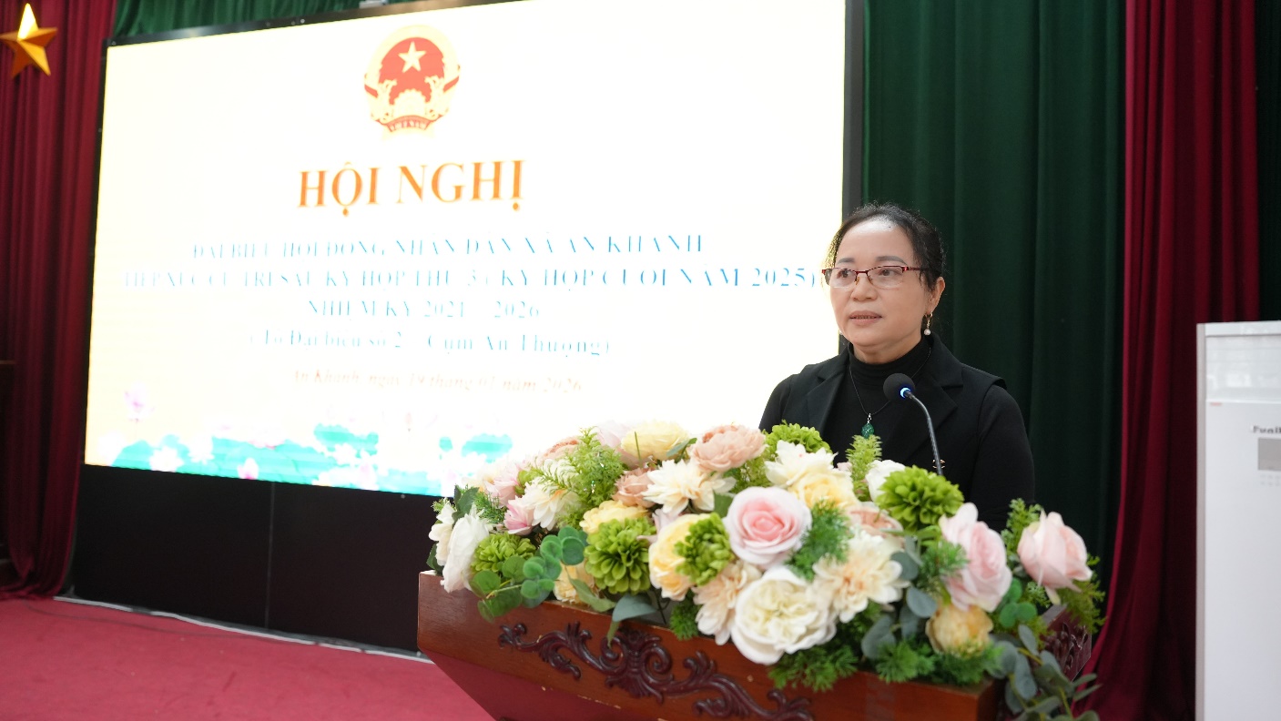 A person standing behind a podium with flowers  AI-generated content may be incorrect.