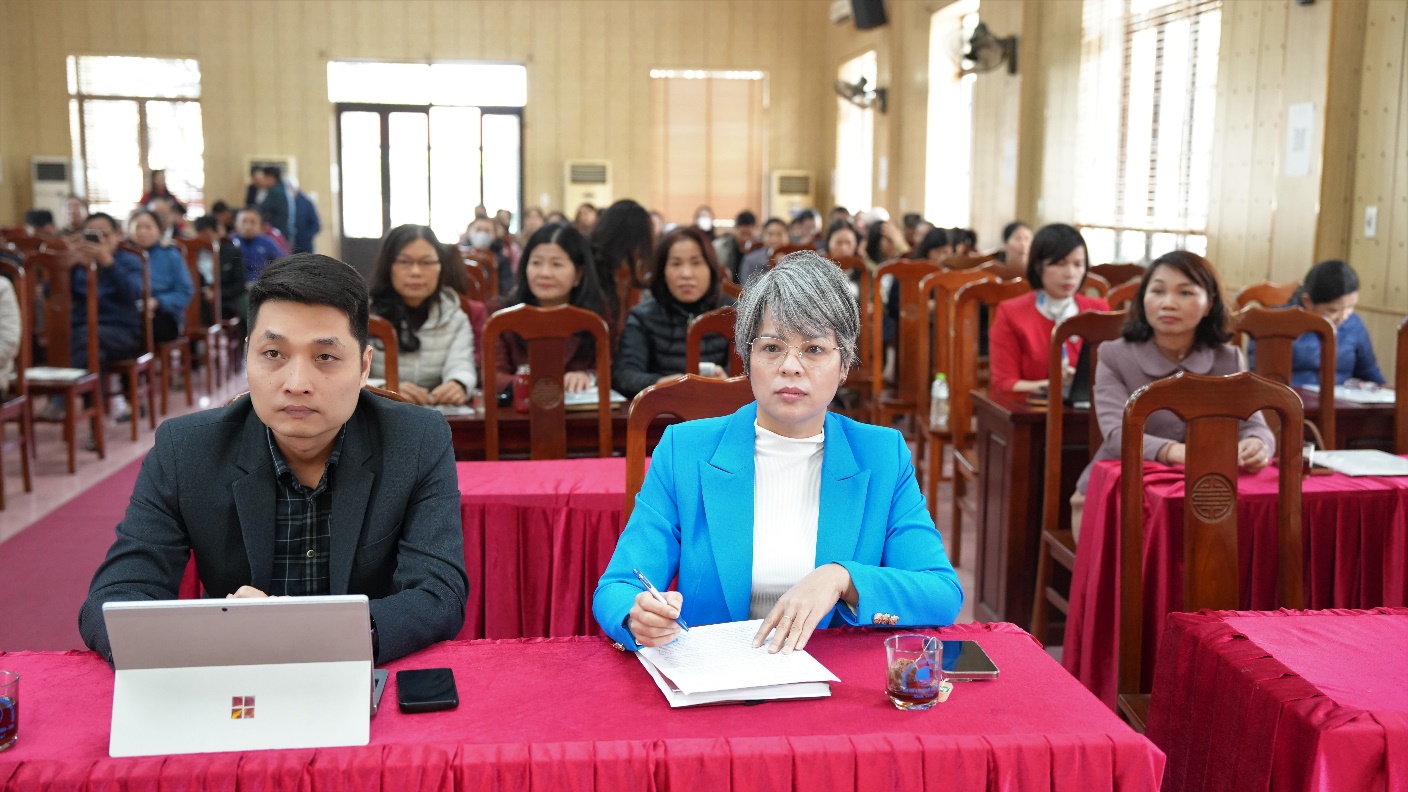 A group of people sitting at a table  AI-generated content may be incorrect.