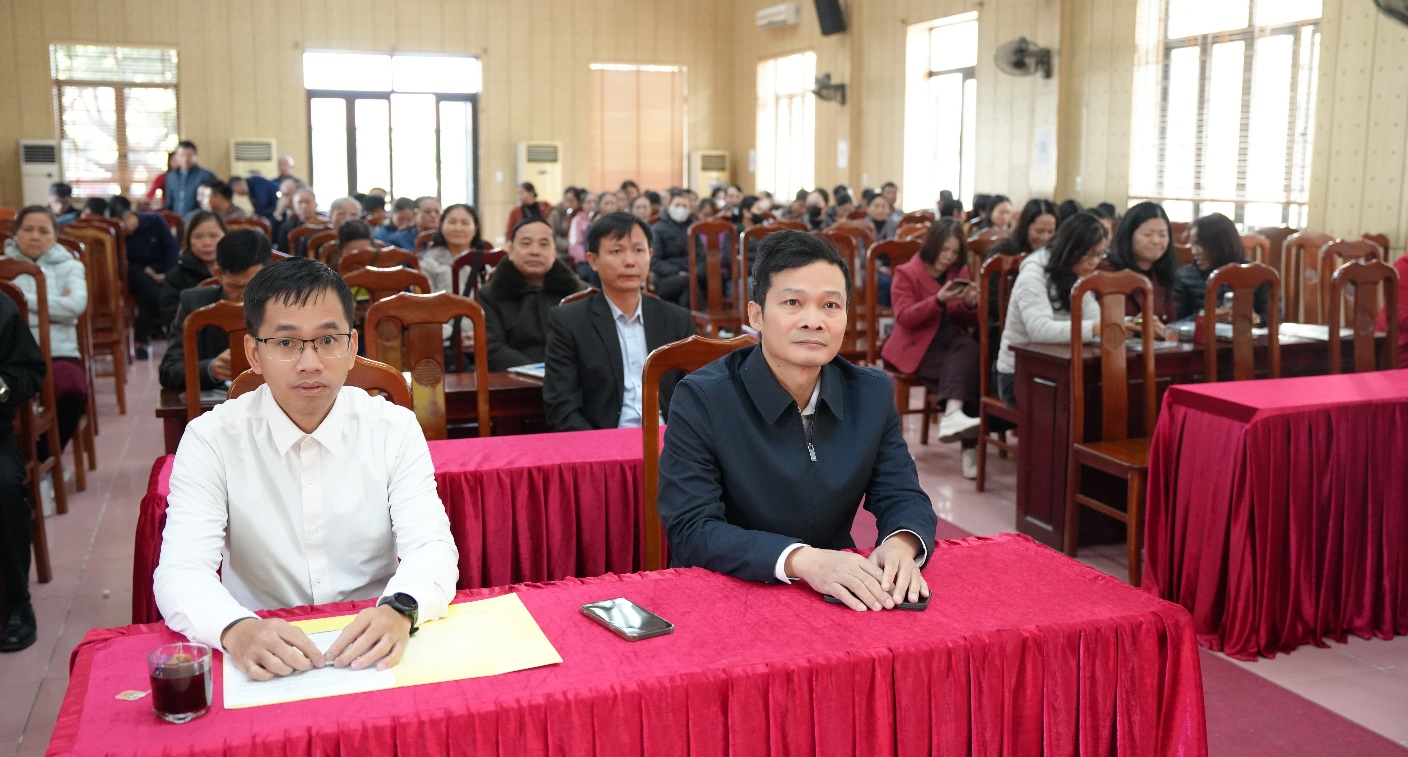 A group of people sitting at a table  AI-generated content may be incorrect.