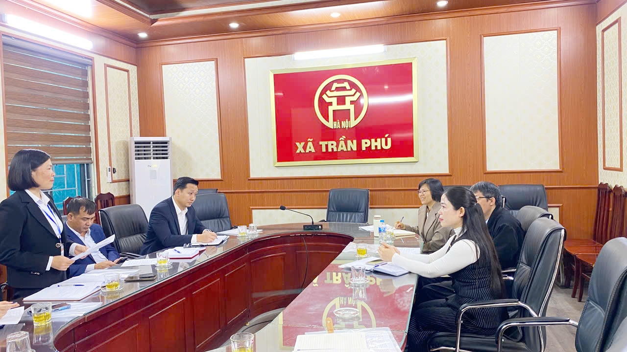 A group of people sitting at a table  AI-generated content may be incorrect.