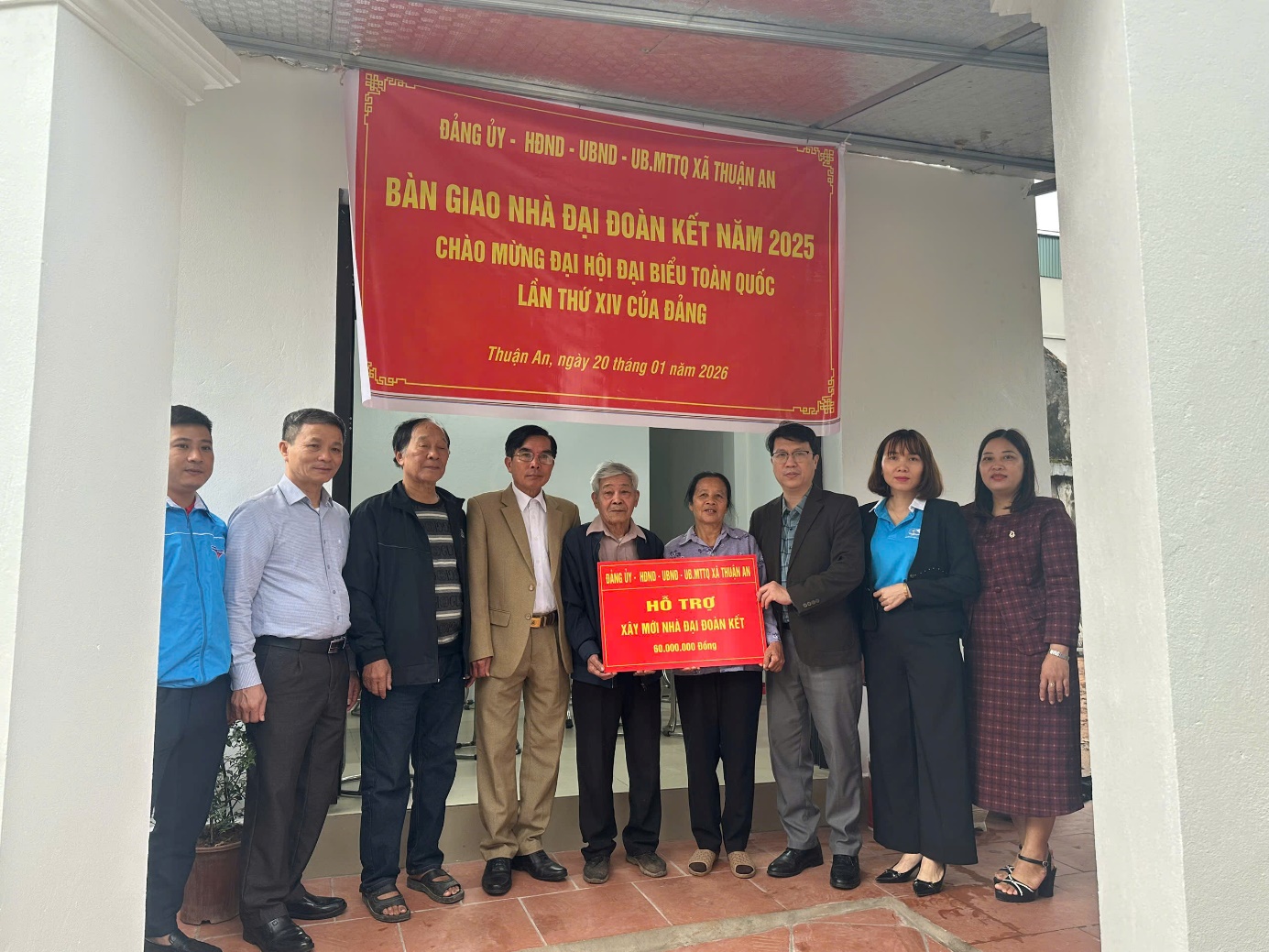 A group of people standing in front of a banner  AI-generated content may be incorrect.