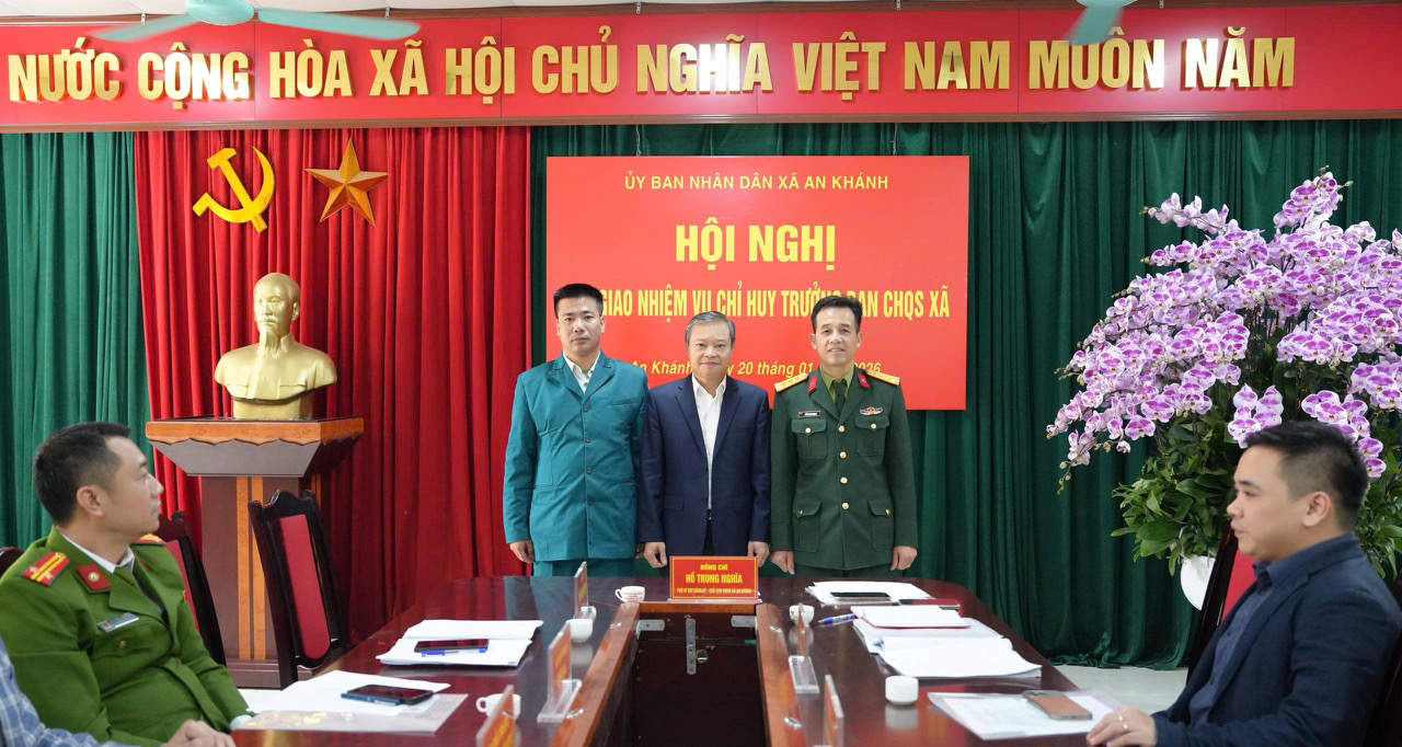 A group of men standing in front of a red banner  AI-generated content may be incorrect.