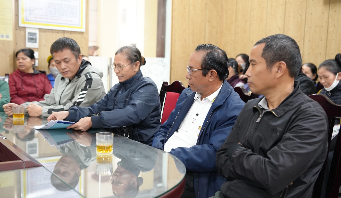 A group of people sitting at a table  AI-generated content may be incorrect.