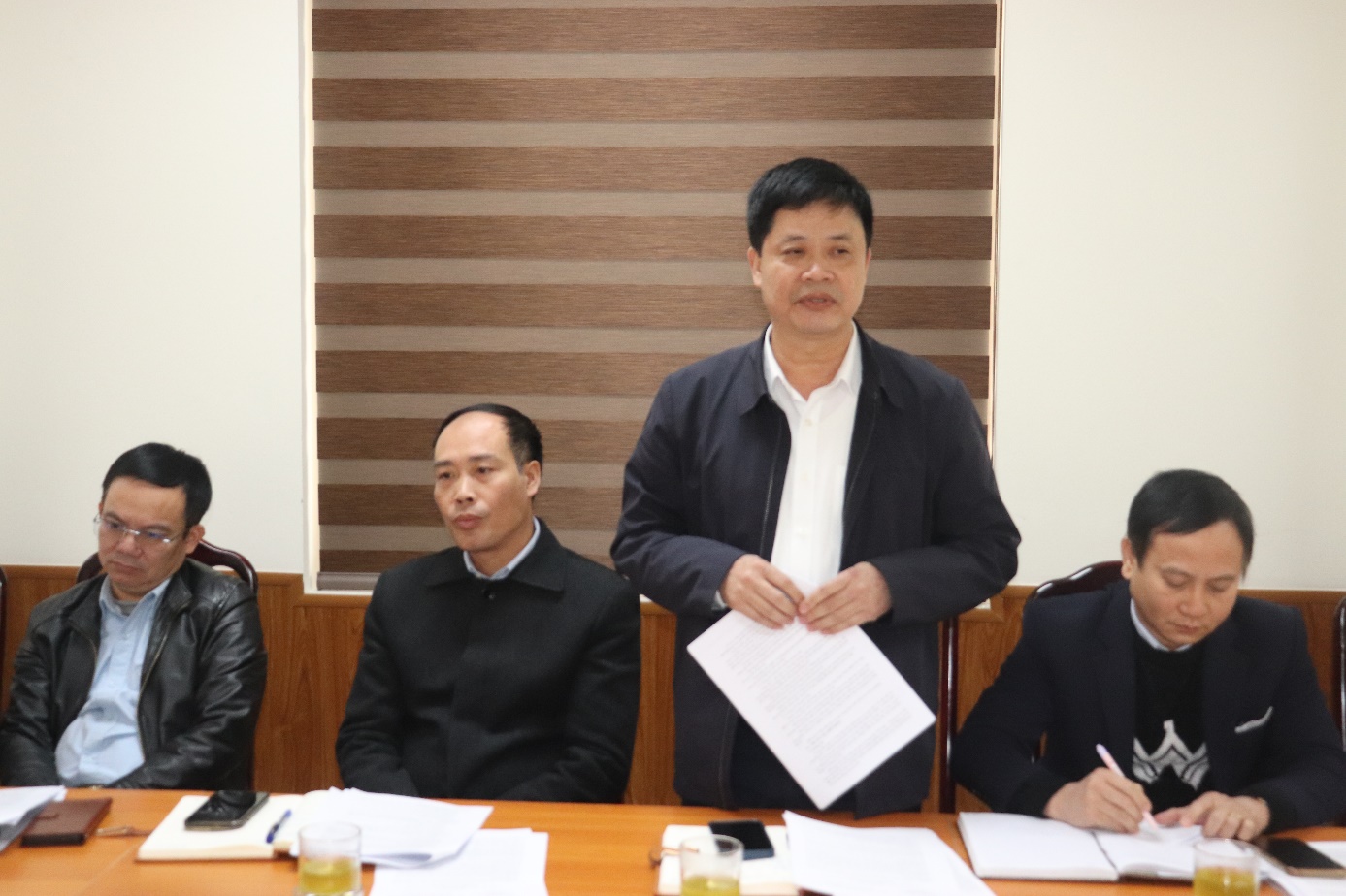 A group of people sitting at a table  AI-generated content may be incorrect.