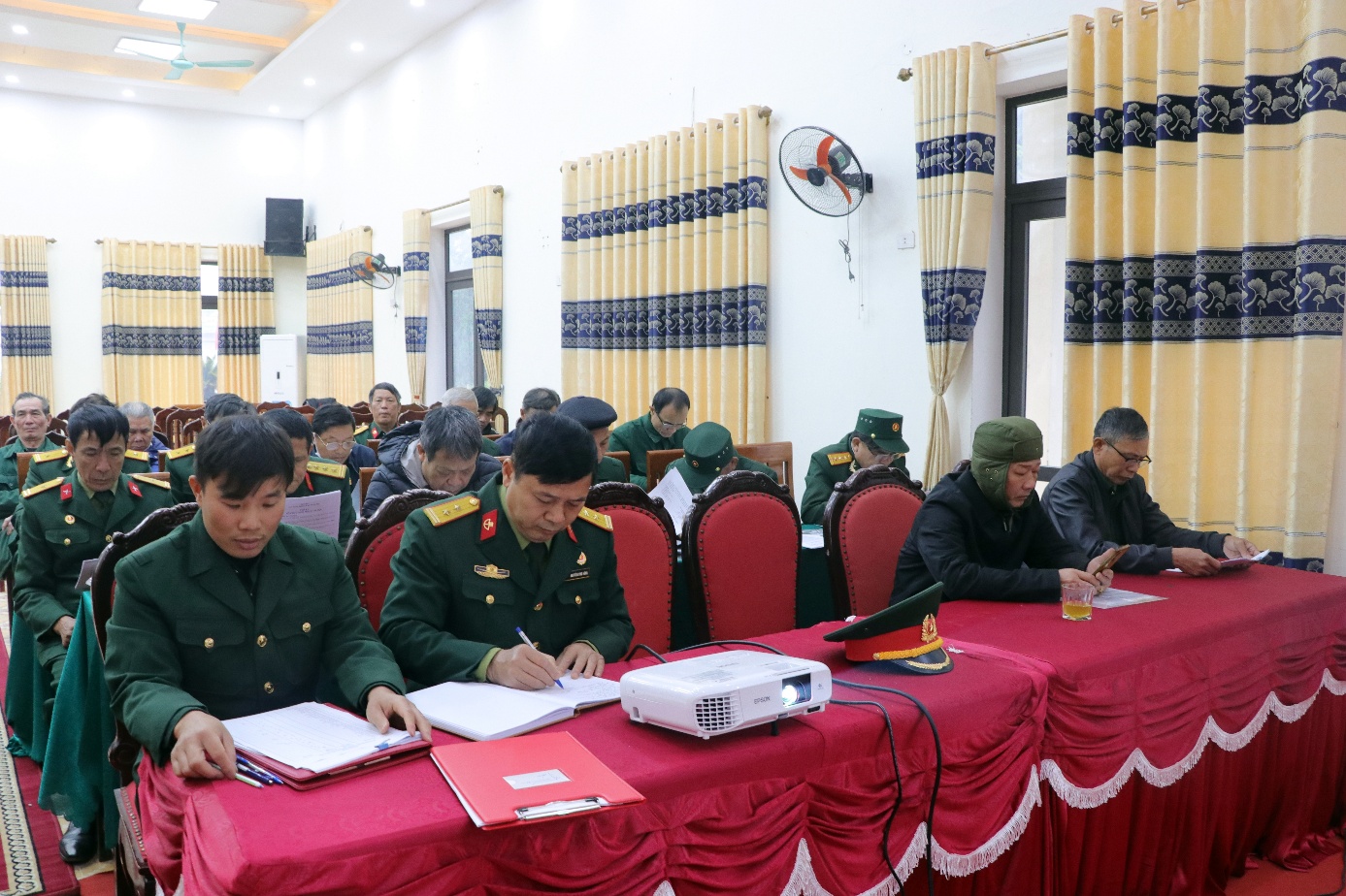 A group of people in military uniforms sitting at a table  AI-generated content may be incorrect.