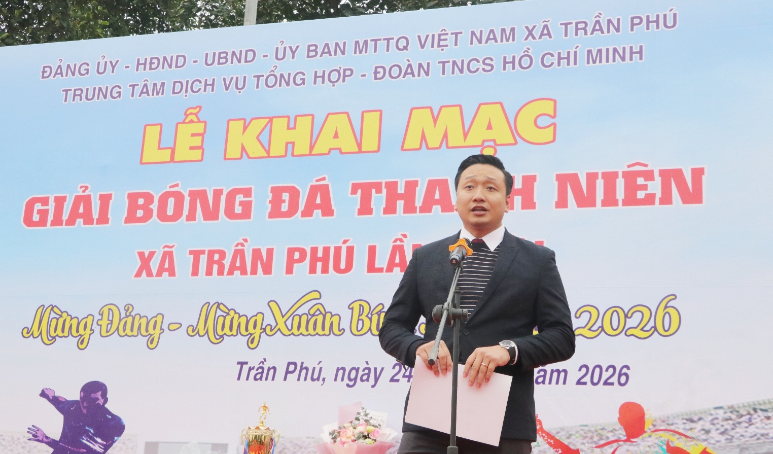 A person standing in front of a sign  AI-generated content may be incorrect.