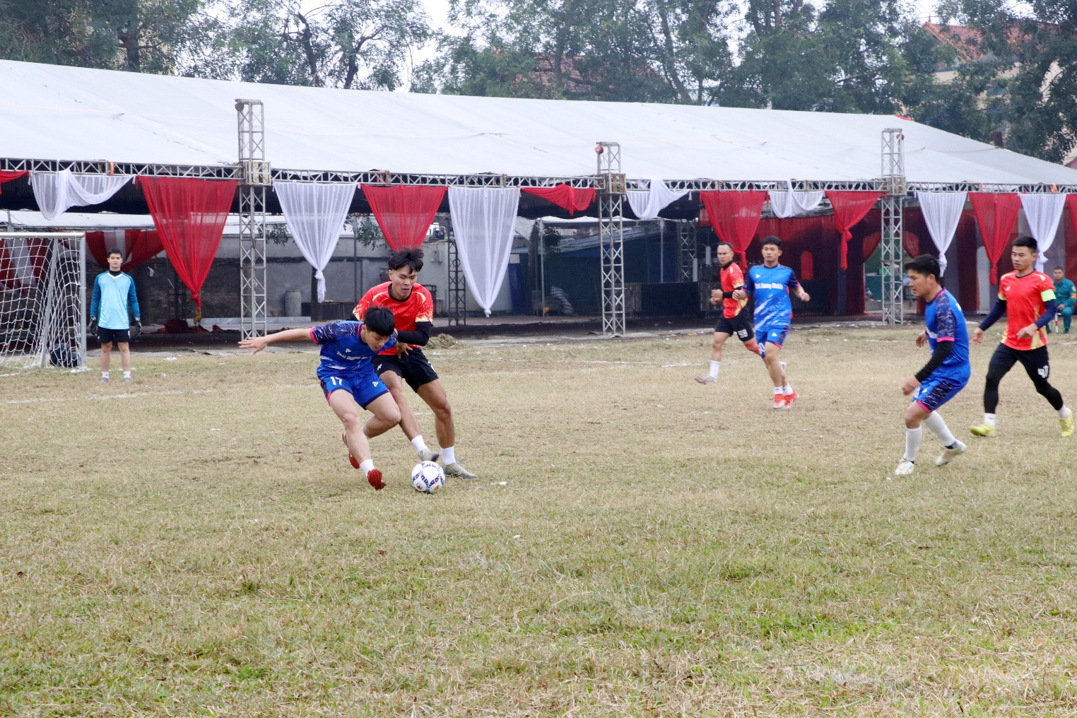 A group of people playing football  AI-generated content may be incorrect.