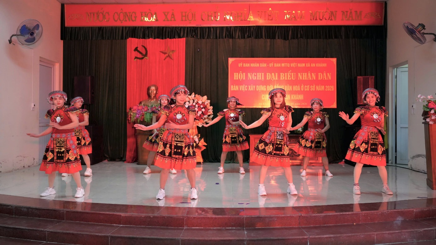 A group of girls performing on stage  AI-generated content may be incorrect.