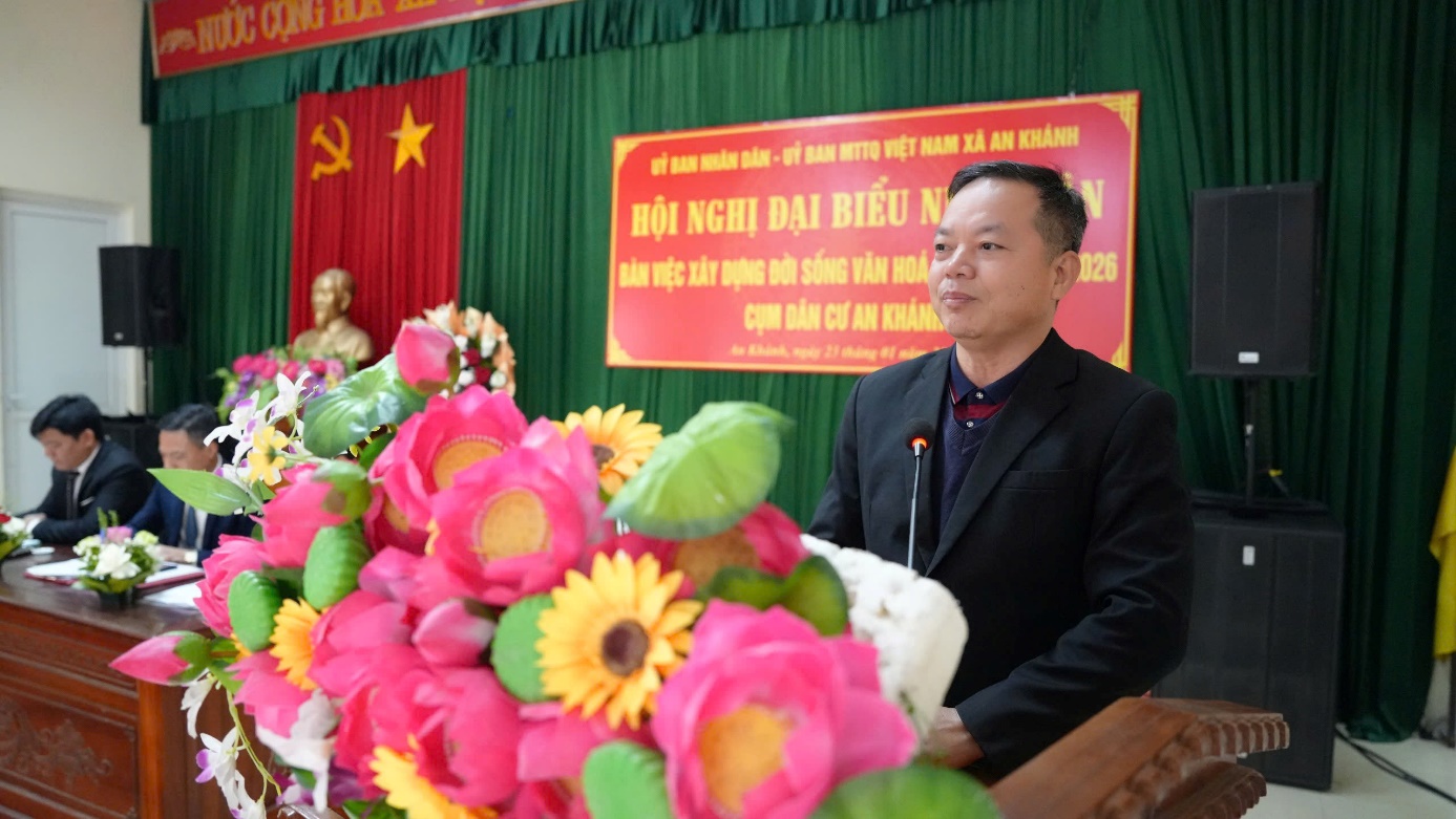 A person standing in front of a podium with flowers  AI-generated content may be incorrect.