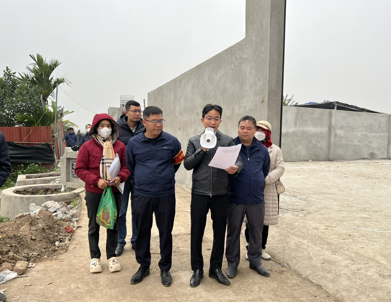 A group of people standing outside  AI-generated content may be incorrect.