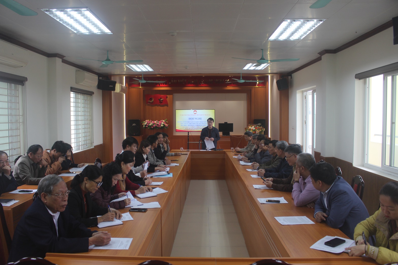 A group of people sitting at a table  AI-generated content may be incorrect.