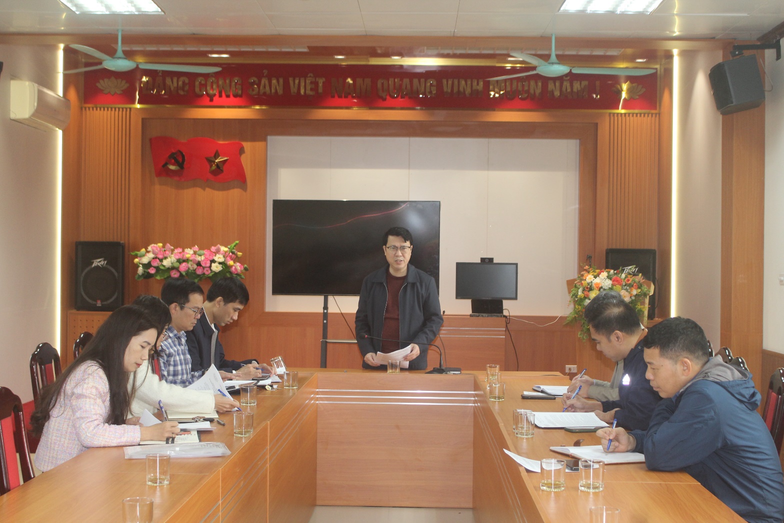 A group of people in a meeting  AI-generated content may be incorrect.