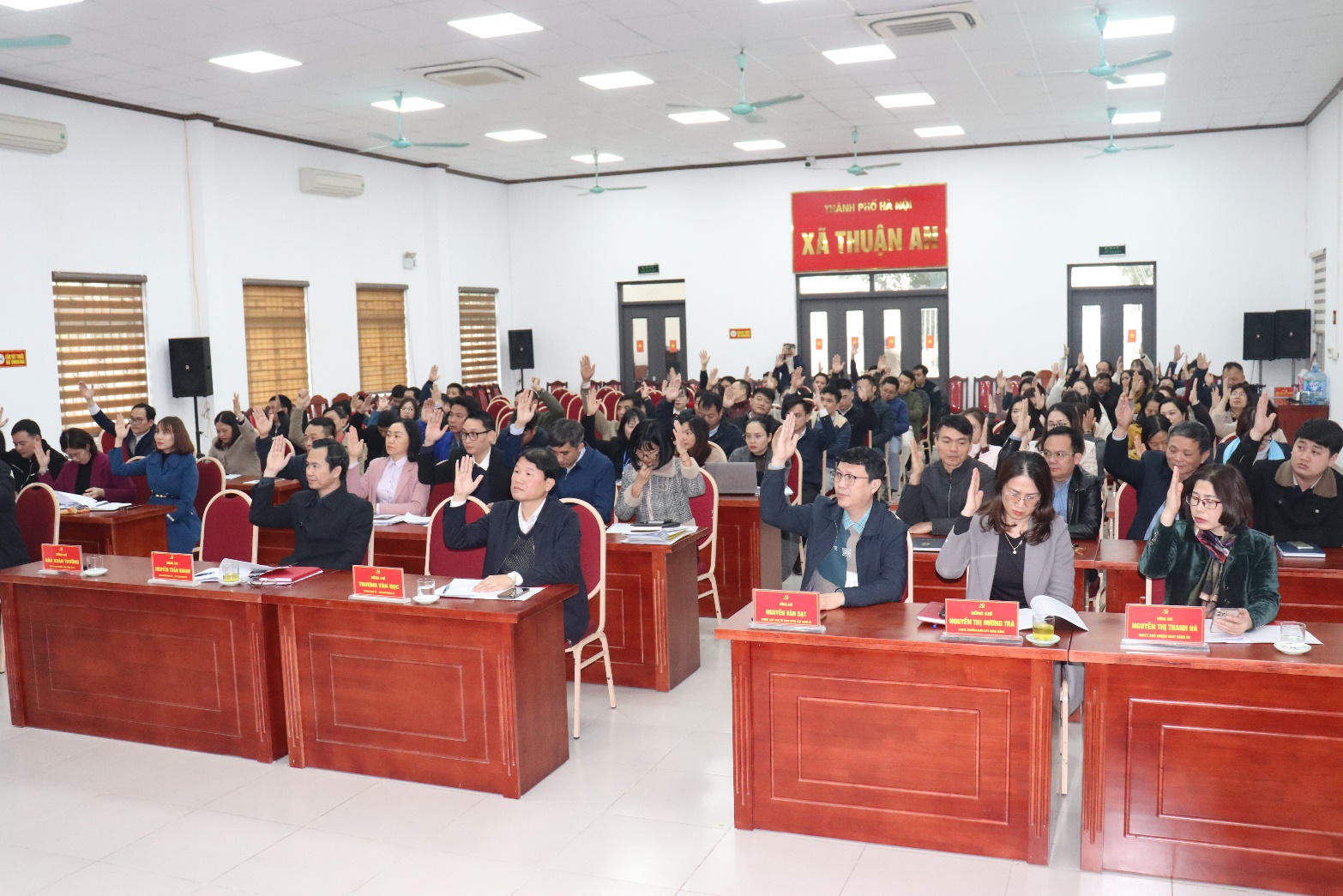 A group of people in a room  AI-generated content may be incorrect.