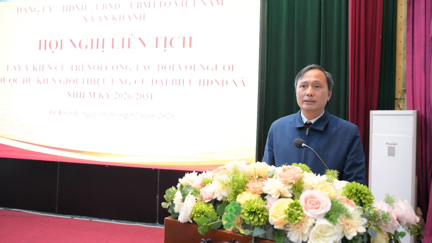 A person standing at a podium with flowers  AI-generated content may be incorrect.