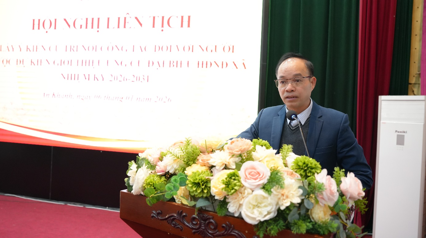 A person standing at a podium with flowers  AI-generated content may be incorrect.