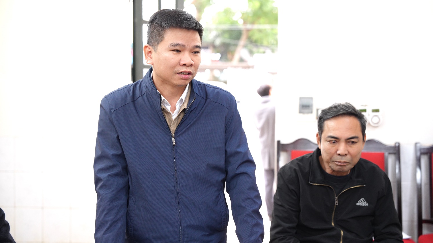 A person standing next to another person  AI-generated content may be incorrect.