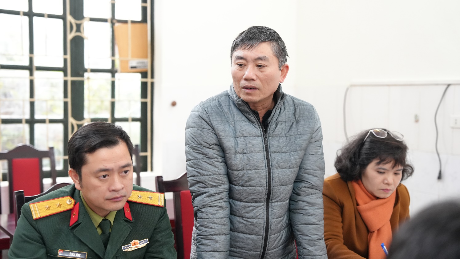 A group of people in a room  AI-generated content may be incorrect.