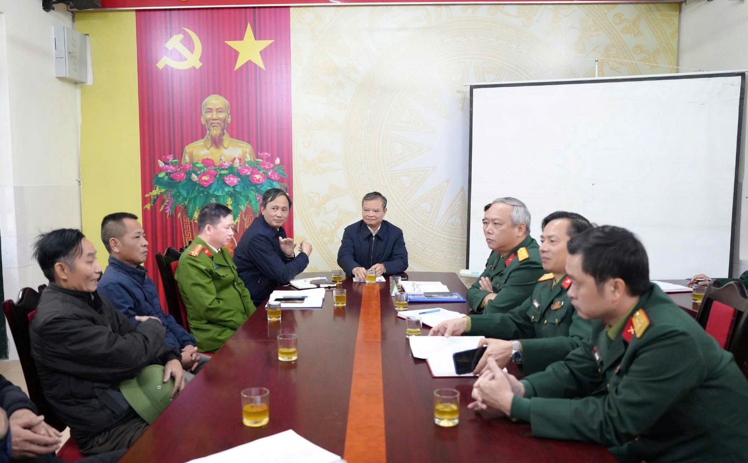 A group of people sitting at a table  AI-generated content may be incorrect.