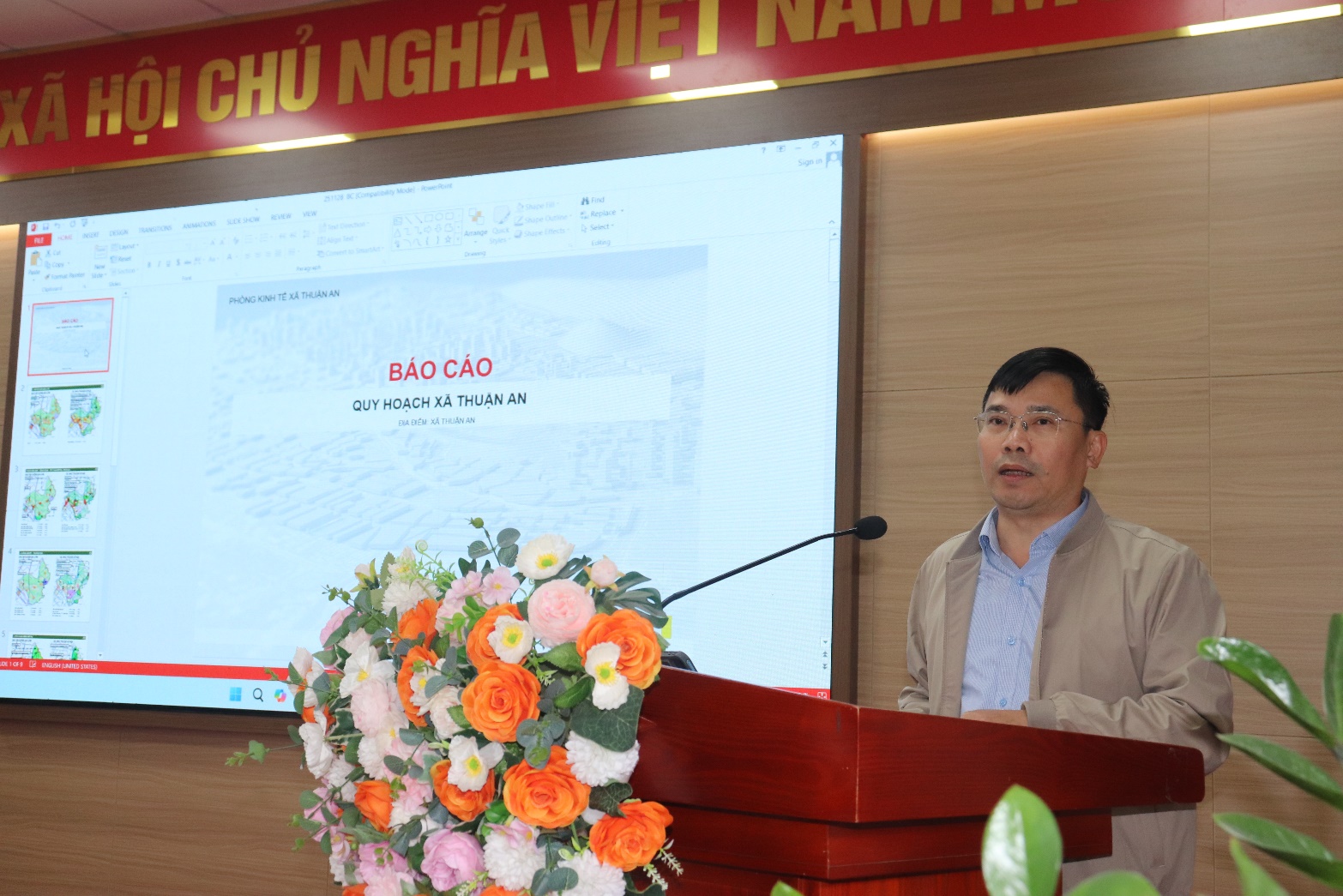 A person standing at a podium  AI-generated content may be incorrect.