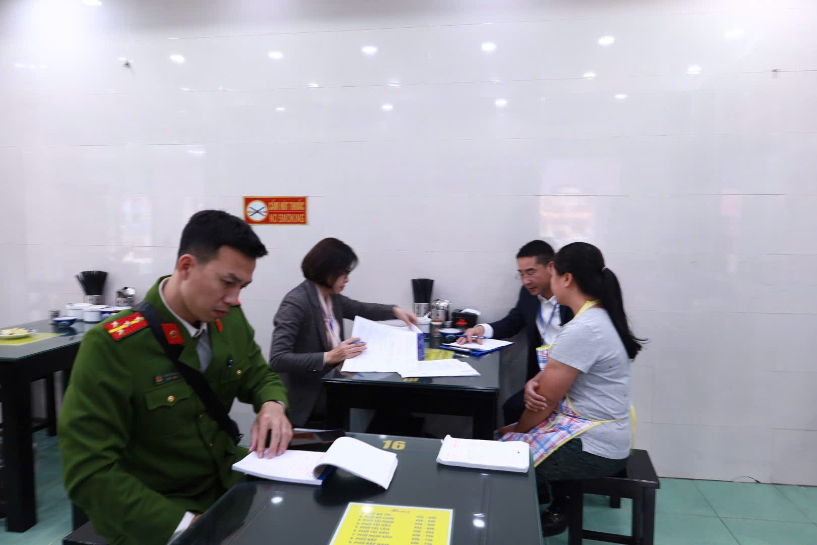 A group of people sitting around a table  Description automatically generated