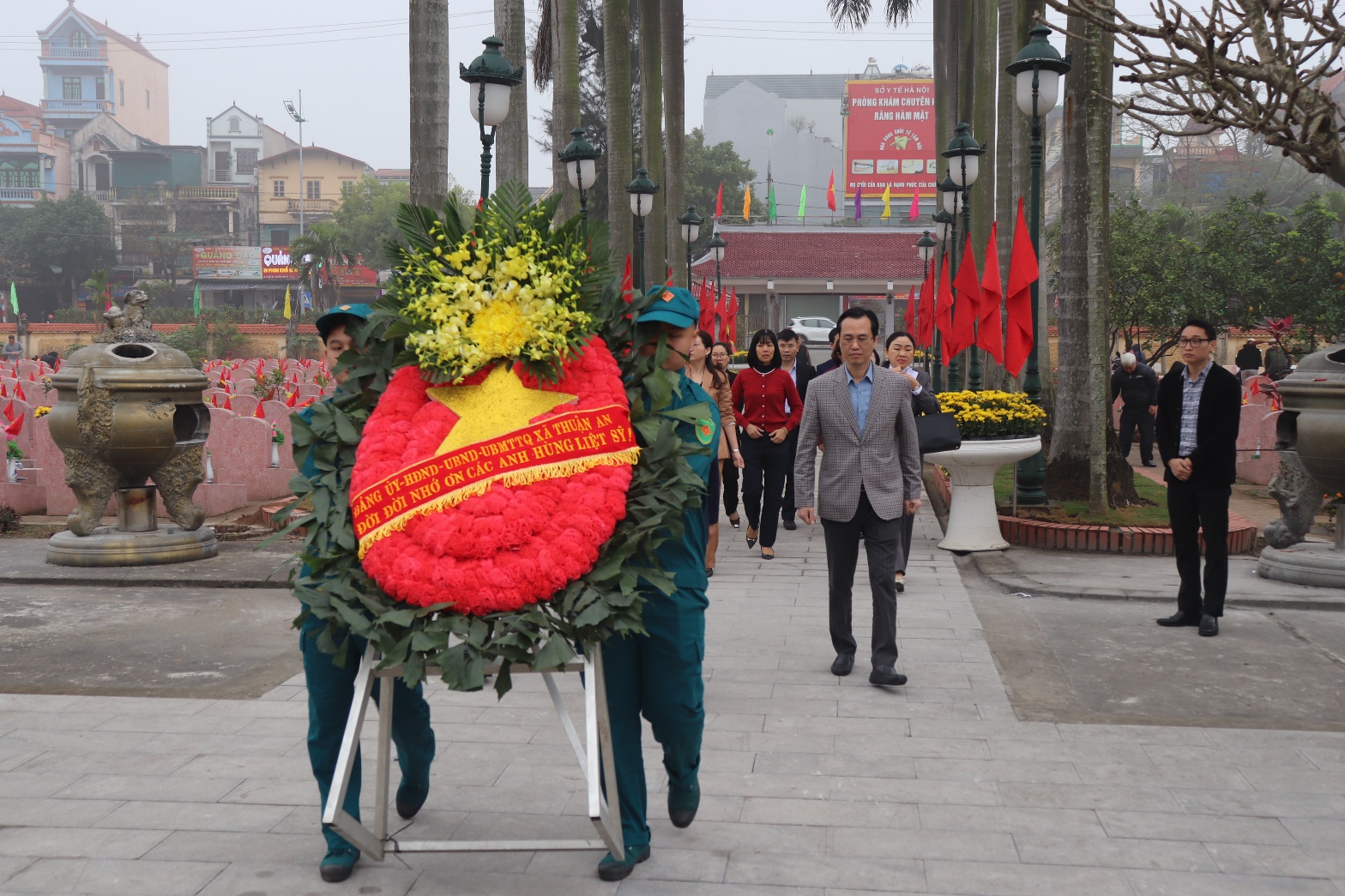 A group of people walking on a sidewalk  AI-generated content may be incorrect.