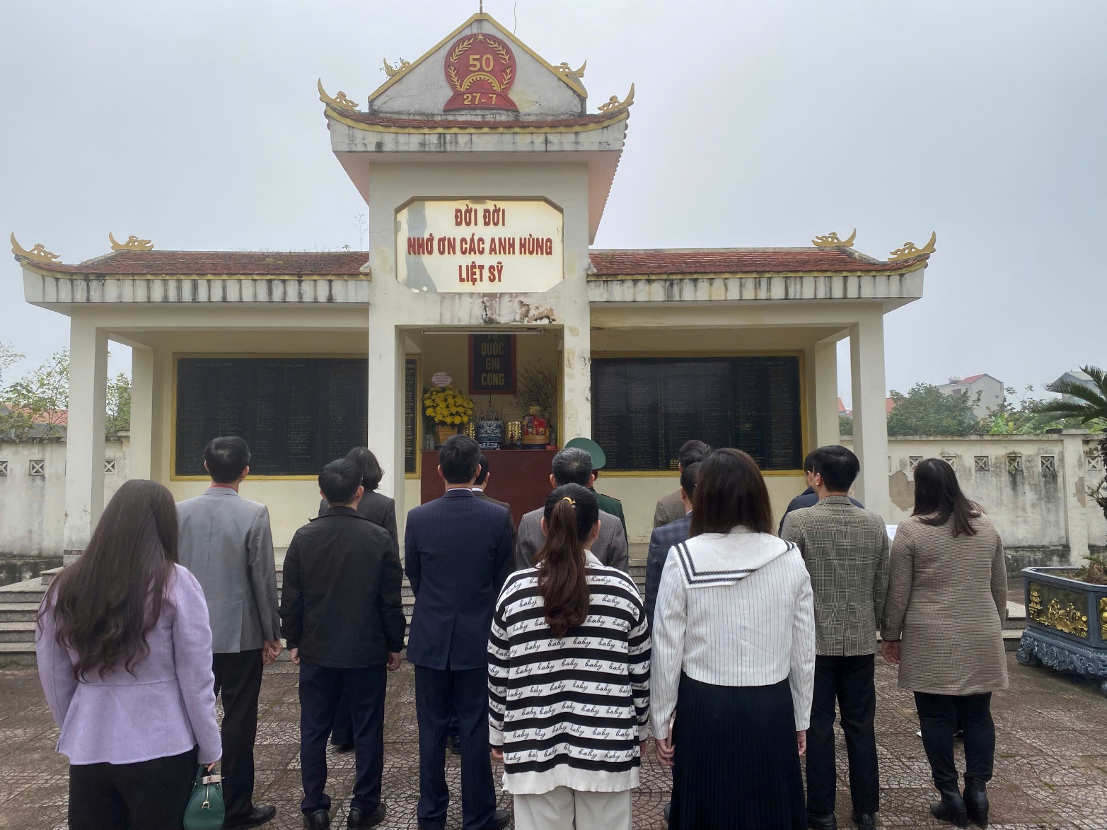 A group of people standing in front of a building  AI-generated content may be incorrect.