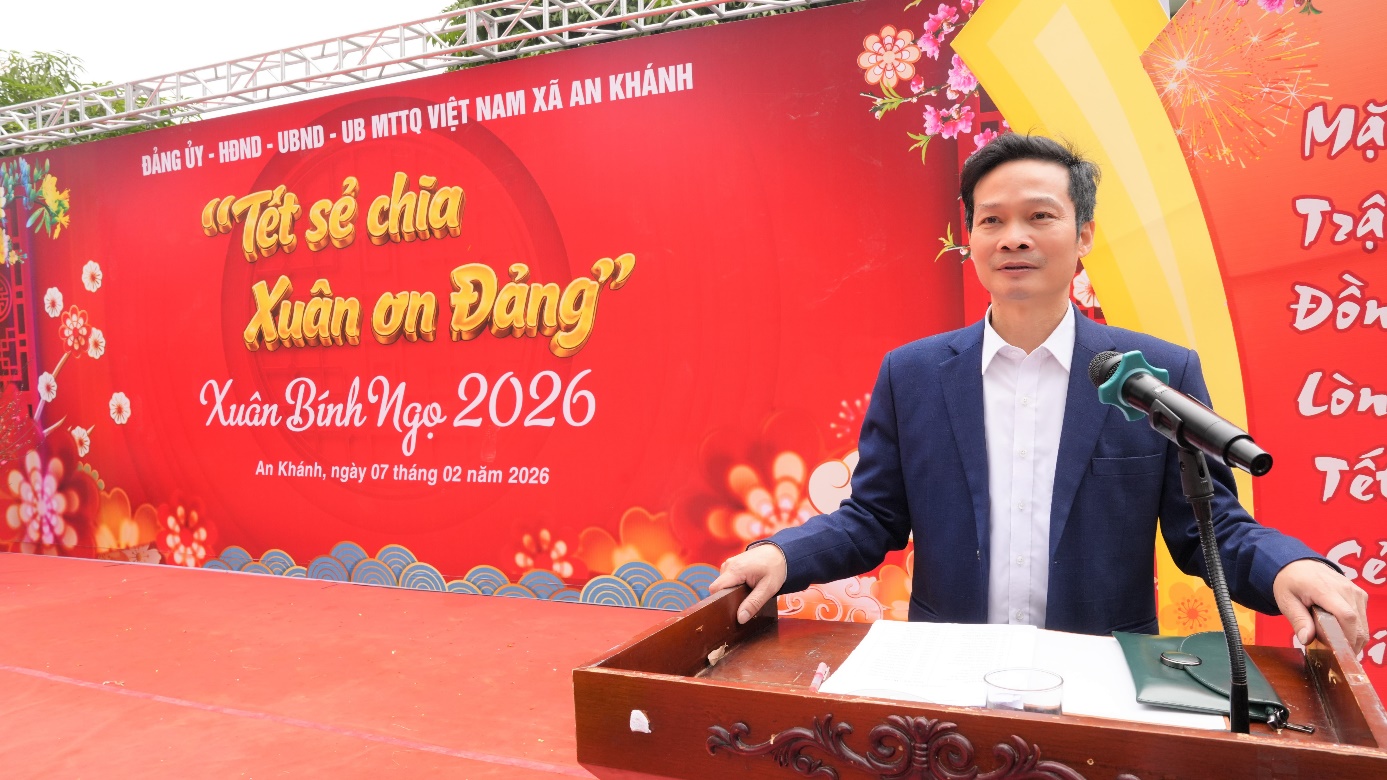 A person standing in front of a red banner  AI-generated content may be incorrect.