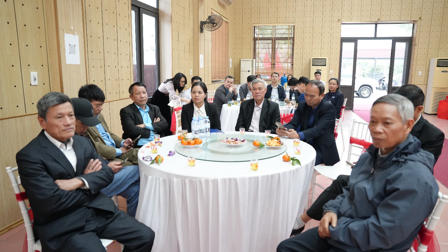 A group of people sitting around a round table  AI-generated content may be incorrect.