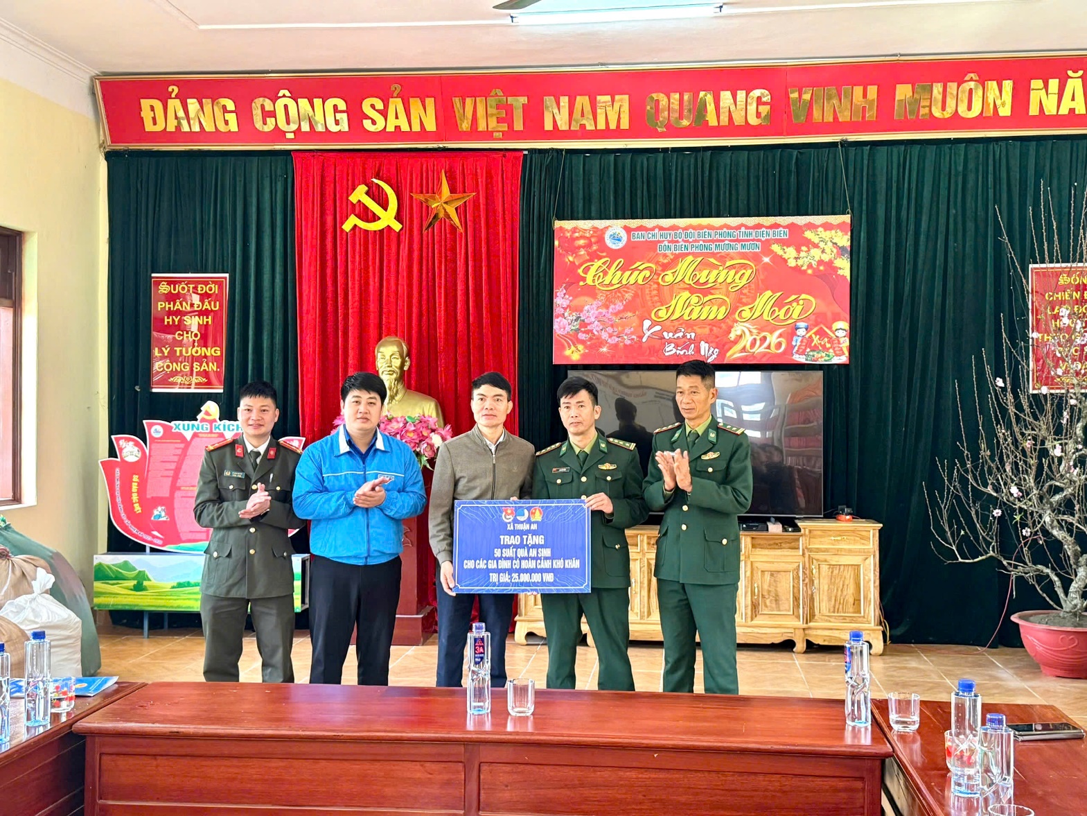 A group of men standing in front of a stage  AI-generated content may be incorrect.