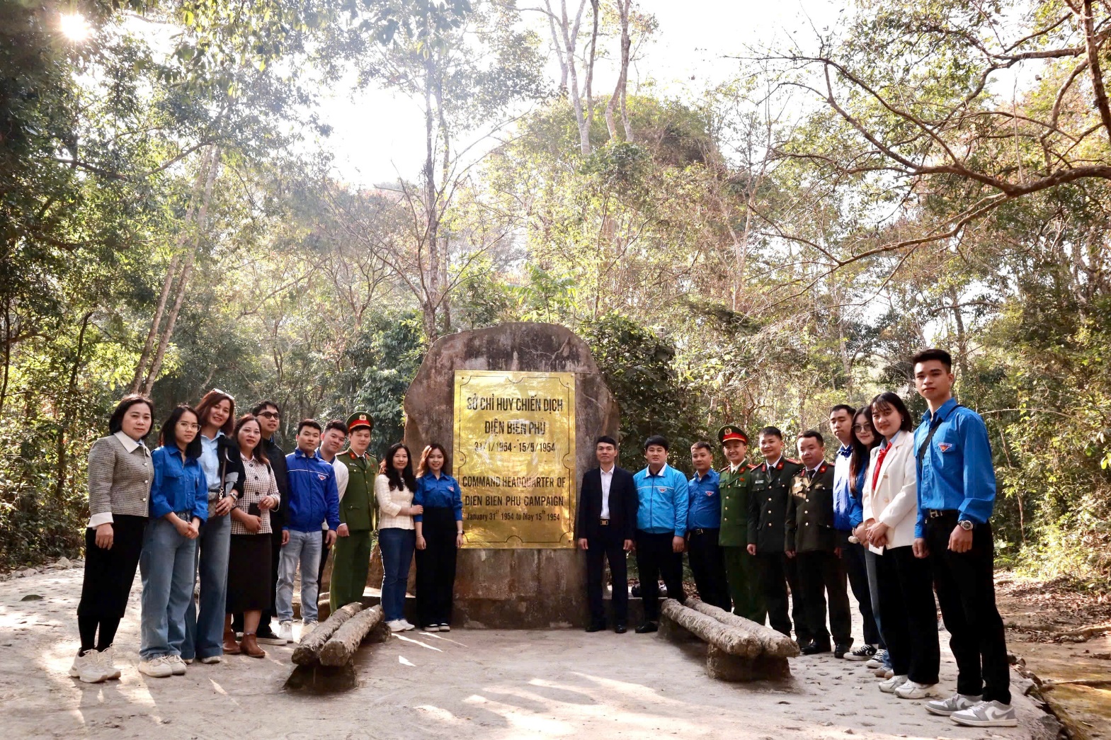 A group of people standing in front of a sign  AI-generated content may be incorrect.