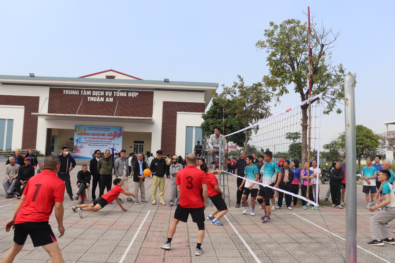 A group of people playing volleyball  AI-generated content may be incorrect.