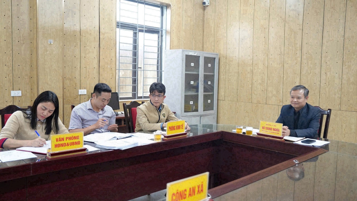 A group of people sitting at a desk  AI-generated content may be incorrect.