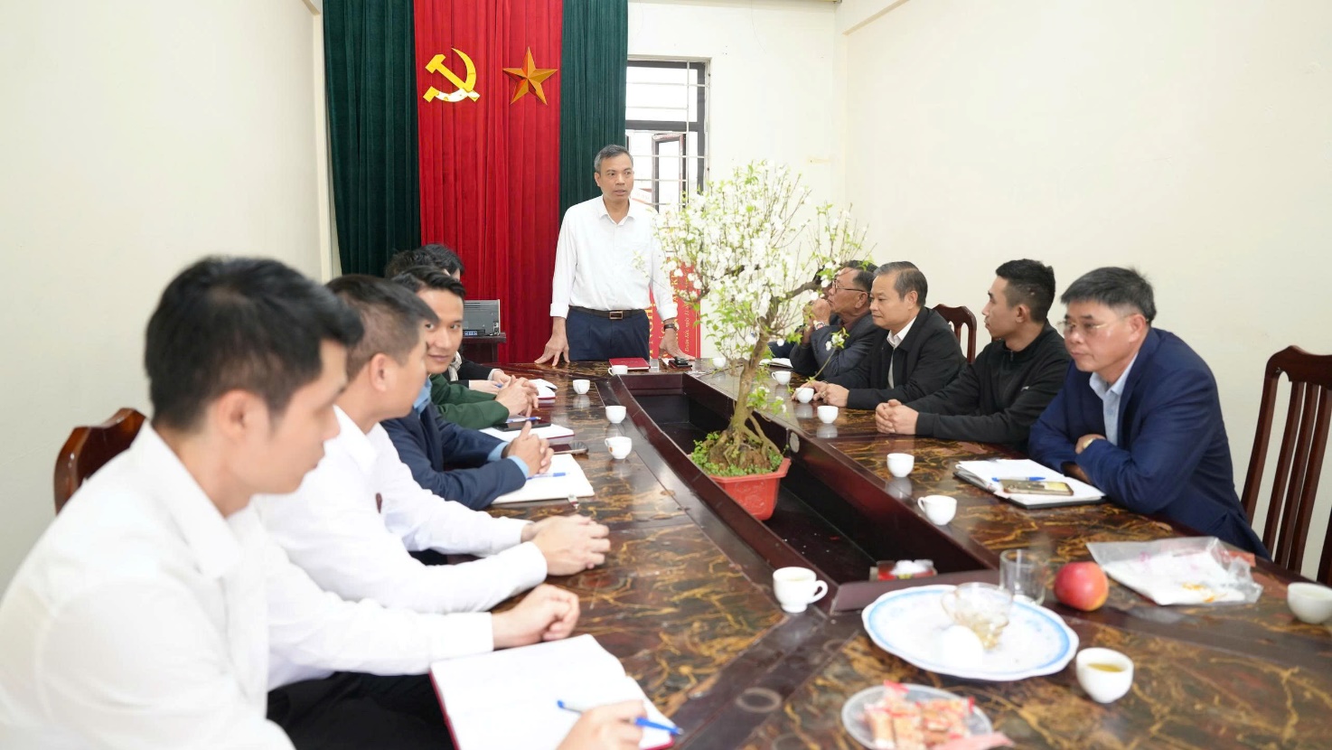 A group of people sitting around a long table  AI-generated content may be incorrect.